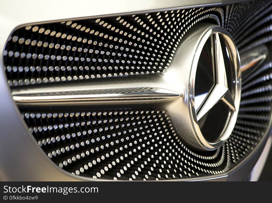 Photo of pattern on Mercedes concept car front grill. Silver hexagons create a starry sky motif.