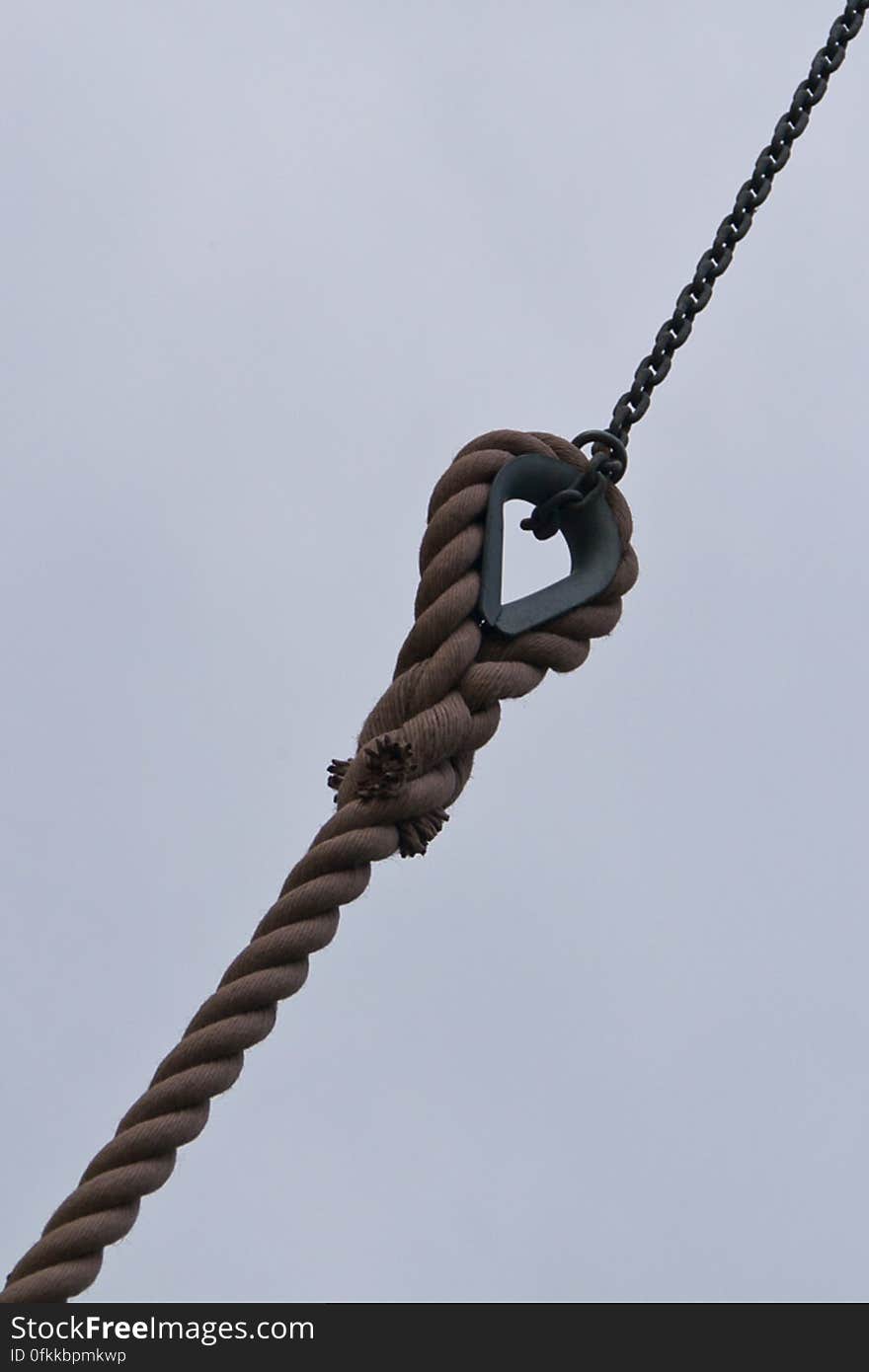 Manila rope and metal chain used to hold in place windmill blades.