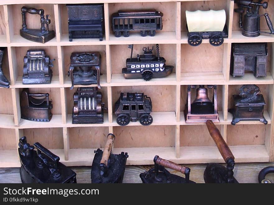 metal-miniatures-on-wooden-shelf