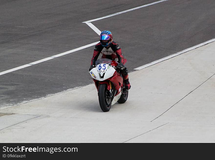 Motorcycle driver pulling to the paddocks