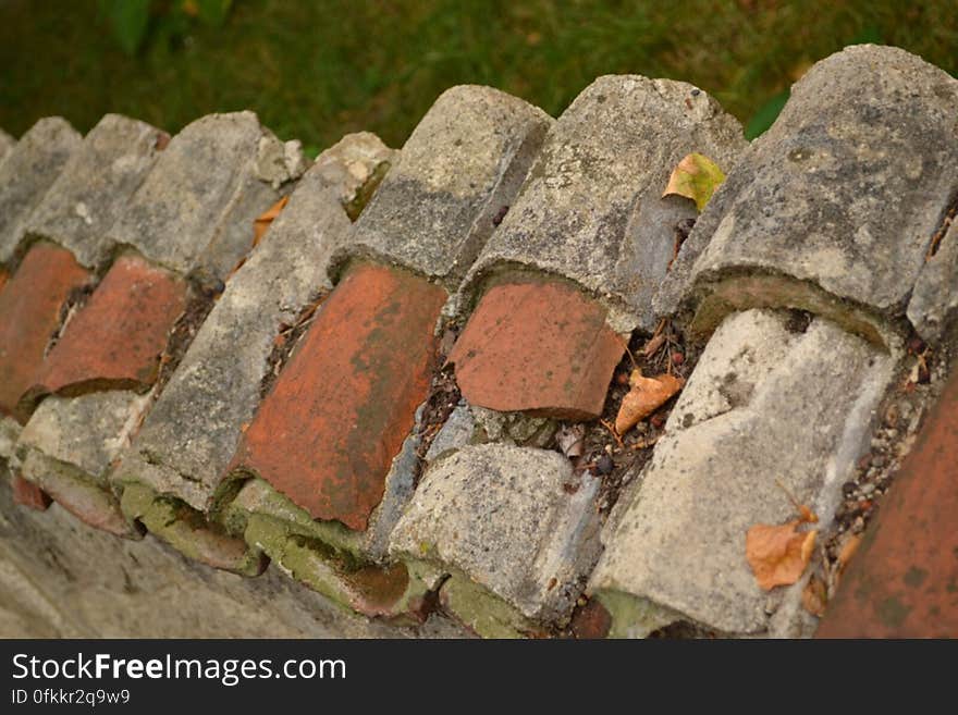 row-of-broken-roof-tiles