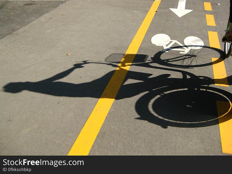 shadow-of-a-girl-riding-bicycle