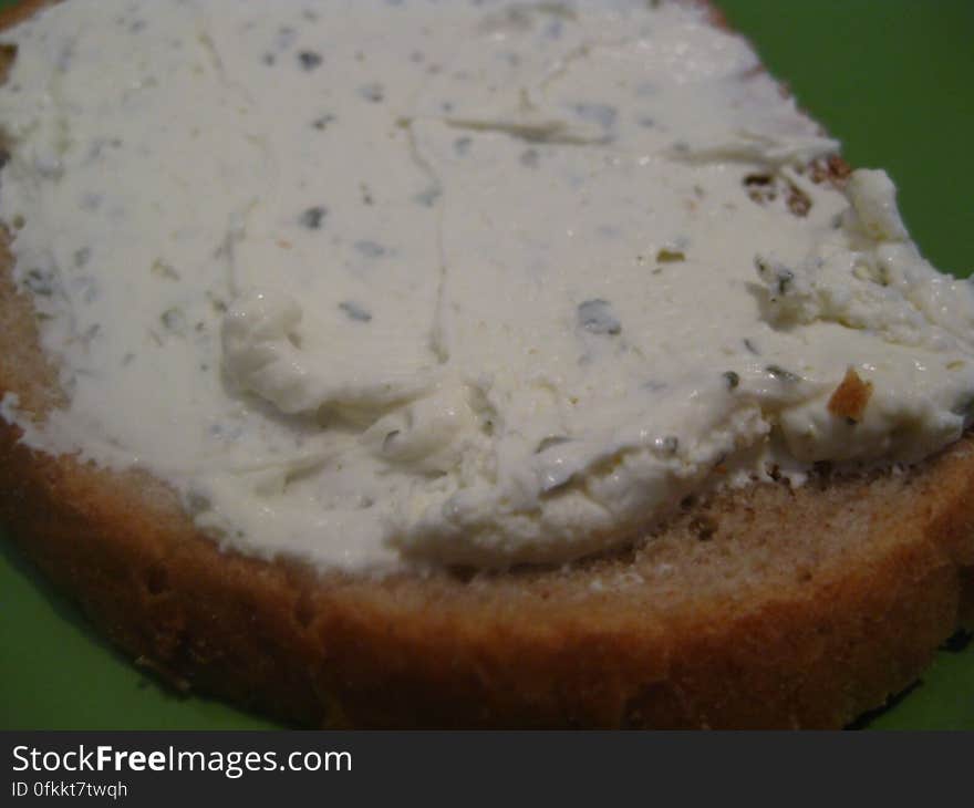 slice-of-bread-with-cream-cheese-and-herbs