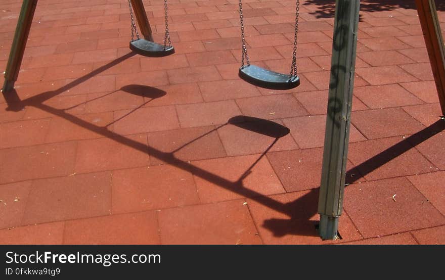 swings-casting-shadow-on-playground