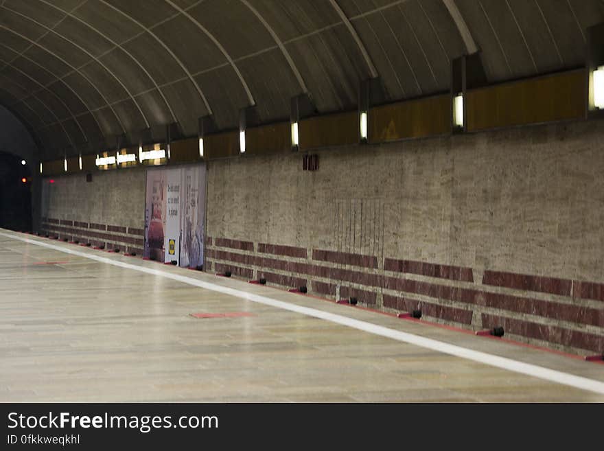 Photo of an underground urban railroad. This station&#039;s main characteristic is the lack of supporting pillars thus the wide open space.