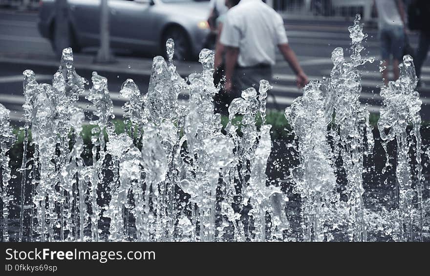 Fountain taken with very short exposure so that bulk flow and water droplets are both clearly defined, urban Summer background. Fountain taken with very short exposure so that bulk flow and water droplets are both clearly defined, urban Summer background.