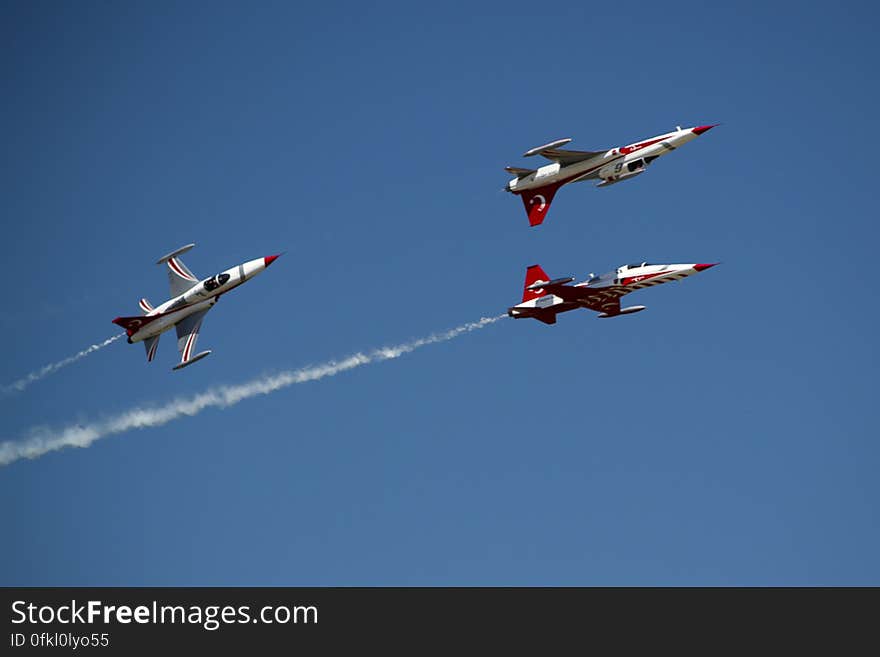 Turkish aerobatics team of NF-5A Freedom Fighter flying at air show.