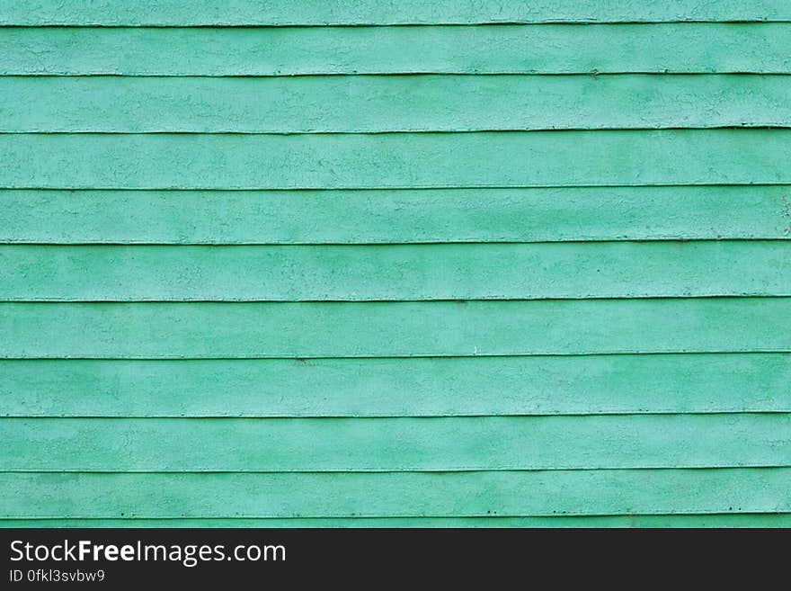 Green painted slats of house wall. Green painted slats of house wall