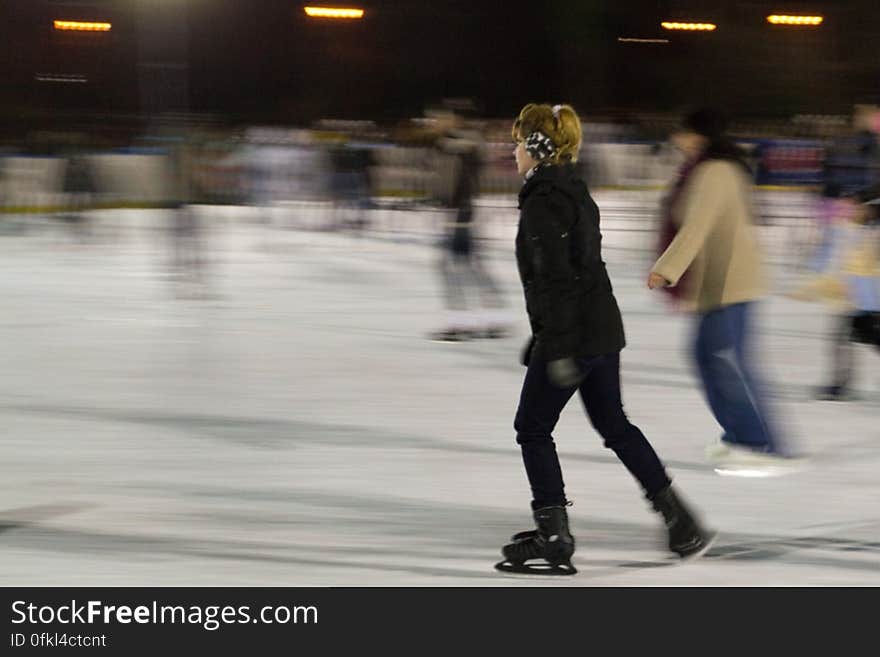 woman-gliding-on-ice-at-skating-rink