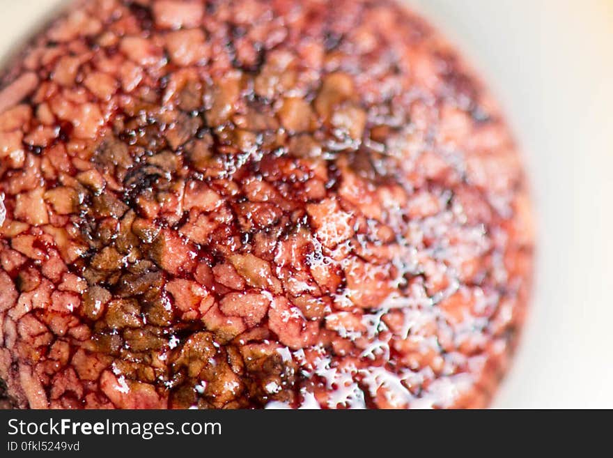 Freshly opened wine bottle cork moist with red Syrah wine.