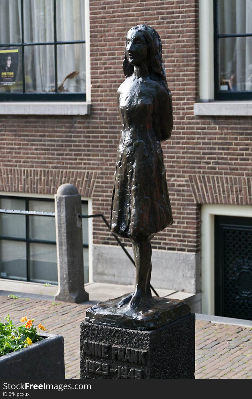 Statue of famous Jewish young diarist Annelies Marie &#x22;Anne&#x22; Frank, victim of the Holocaust after hiding with her familiy in an Amsterdam building annex &#x28;Achterh. Statue of famous Jewish young diarist Annelies Marie &#x22;Anne&#x22; Frank, victim of the Holocaust after hiding with her familiy in an Amsterdam building annex &#x28;Achterh