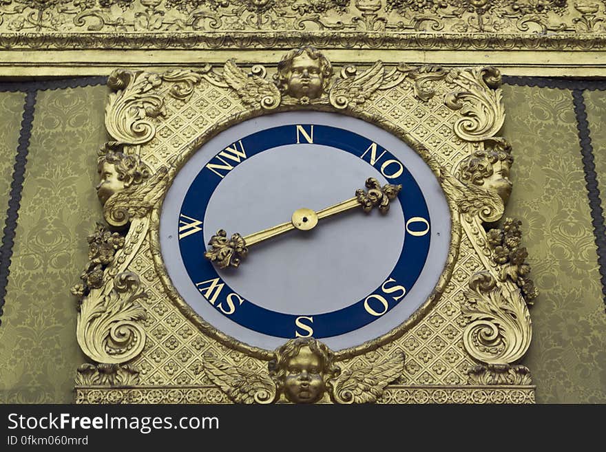 Interior wind dial connected to a golden weather vane in the form of goddess Fortuna on top of Charlottenburg Palace. Interior wind dial connected to a golden weather vane in the form of goddess Fortuna on top of Charlottenburg Palace.