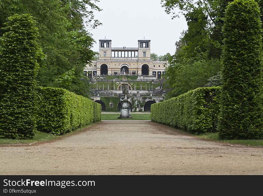 Overview of Orangery Palace and its terraces and garden from Hauptalle - main avenue of Sanssouci Park. Overview of Orangery Palace and its terraces and garden from Hauptalle - main avenue of Sanssouci Park.