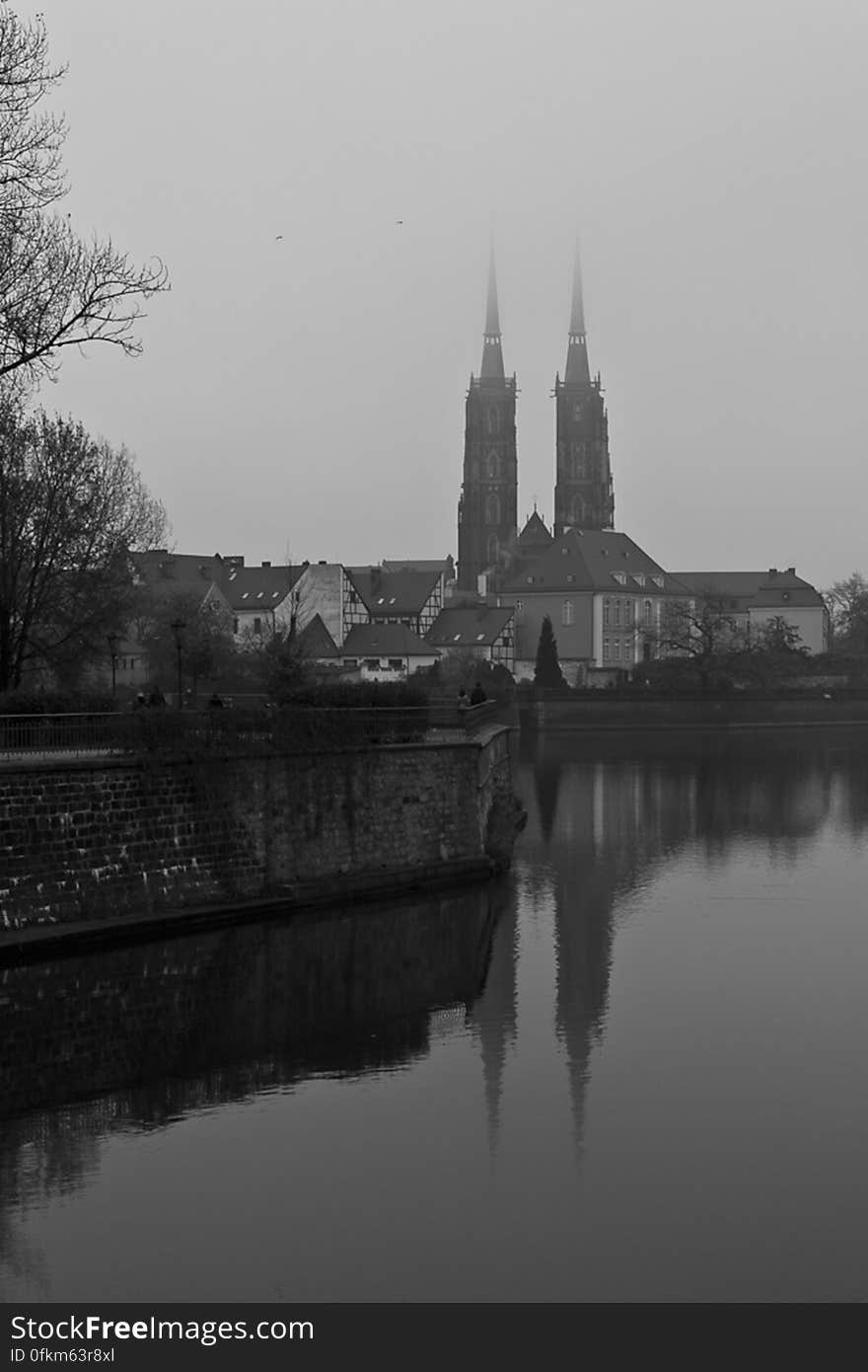 View over Ostrow Tumski Cathedral reflecting towers in Oder river. View over Ostrow Tumski Cathedral reflecting towers in Oder river.