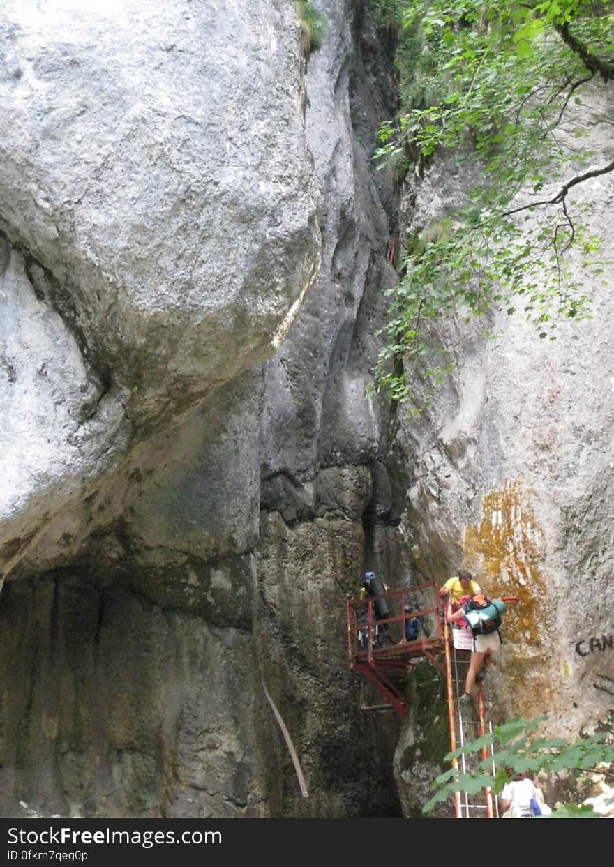 people-climbing-on-canyon-entrance