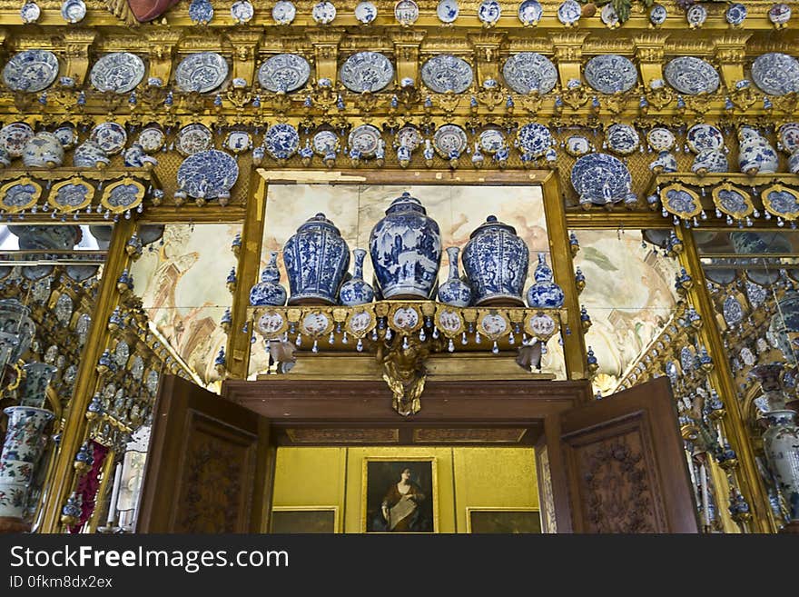 The famous Porcelain room ornated with numerous pieces of Chinese and Japanese porcelain against golden mirrored backdrop. The famous Porcelain room ornated with numerous pieces of Chinese and Japanese porcelain against golden mirrored backdrop.