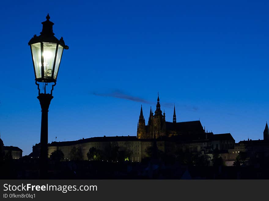 Prague Castle seen at twilight from Charles Bridge across Vltava river. Prague Castle seen at twilight from Charles Bridge across Vltava river.