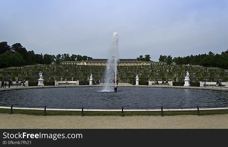 View of Great Fountain surrounded by marble statues in front of the six terraces leading up to Sanssouci Palace. View of Great Fountain surrounded by marble statues in front of the six terraces leading up to Sanssouci Palace.