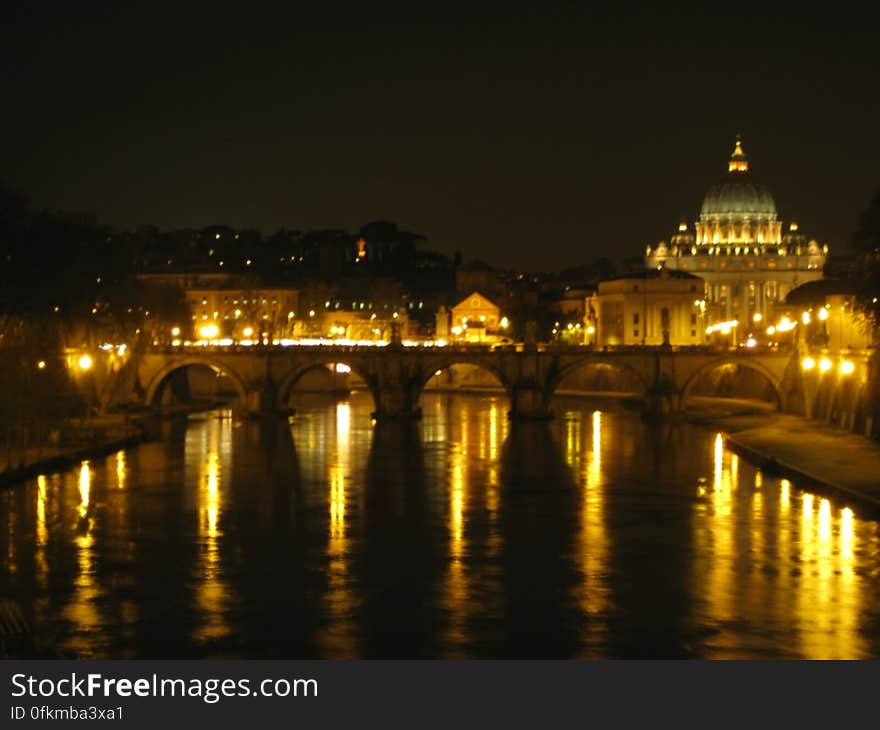 sant-angelo-bridge-and-san-pietro-basilica-at-night