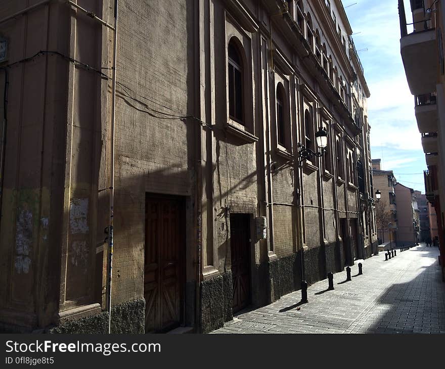 A cobbled alley and an old fashioned building in old town. A cobbled alley and an old fashioned building in old town.