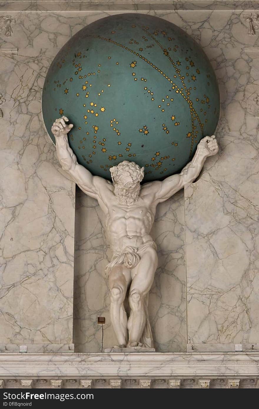 A statue of Atlas holding the sky in Burgerzaal, Royal Palace, Amsterdam. A statue of Atlas holding the sky in Burgerzaal, Royal Palace, Amsterdam.