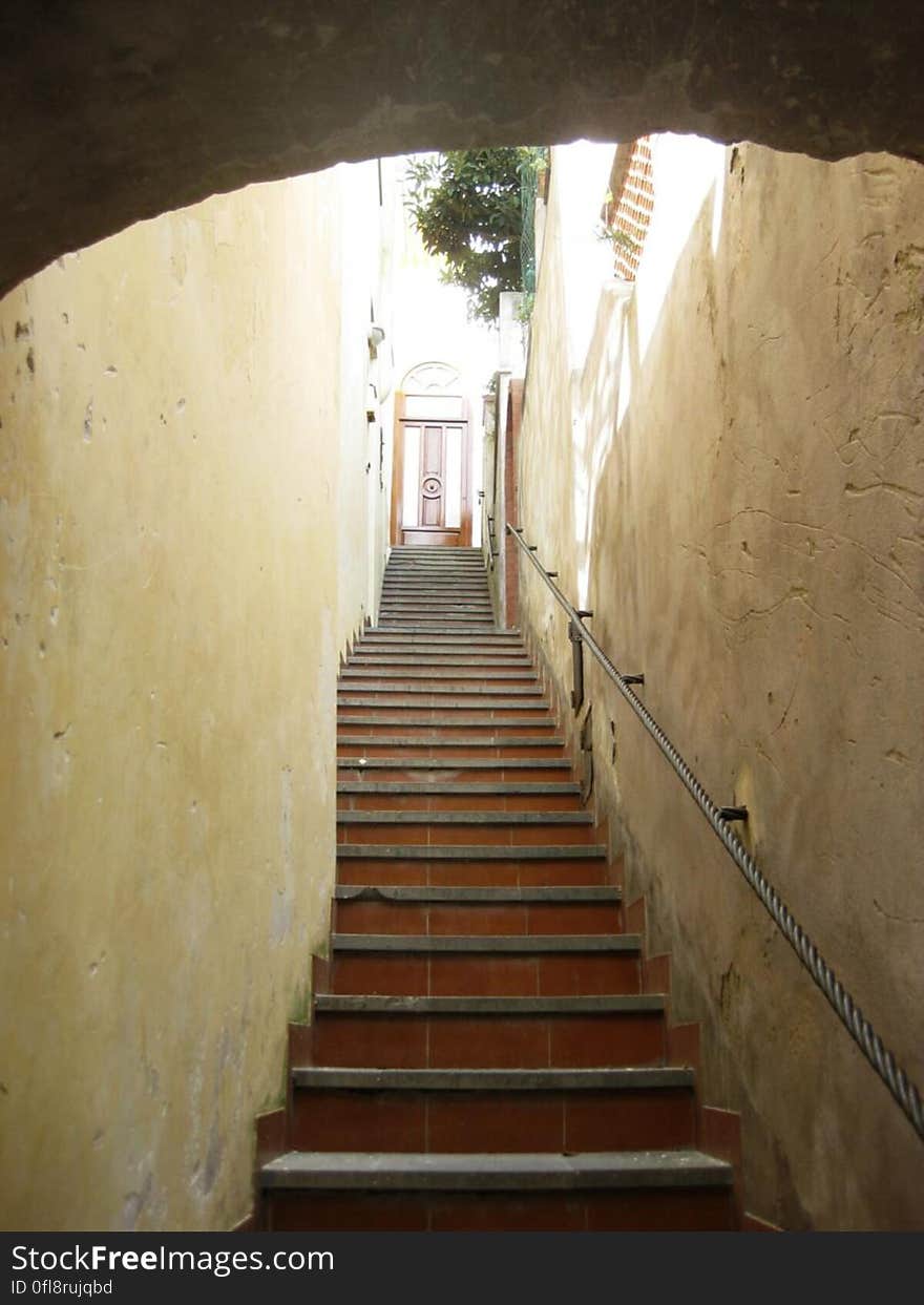 A stairway leading up to a door in the city. A stairway leading up to a door in the city.