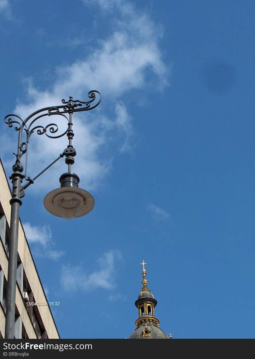 A view of the blue sky and streetlamp. A view of the blue sky and streetlamp.