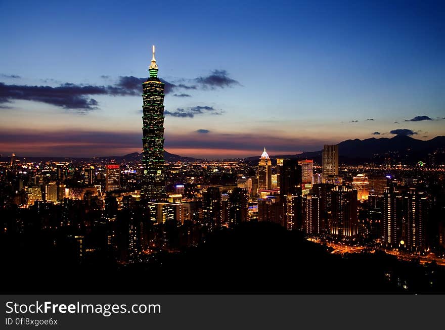 Night skyline of Taipei, Taiwan illuminated at night with 101 Tower. Night skyline of Taipei, Taiwan illuminated at night with 101 Tower.