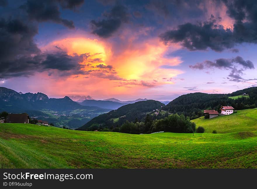 Scenic View of Landscape Against Cloudy Sky