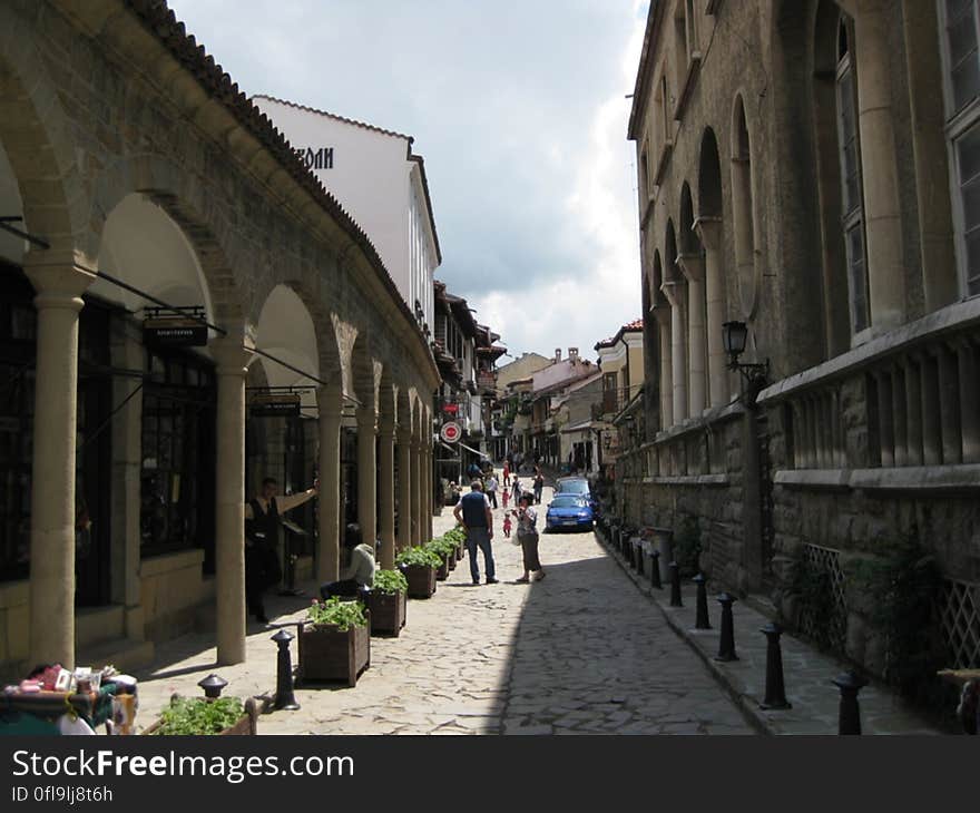 An alleyway with historical buildings in town. An alleyway with historical buildings in town.