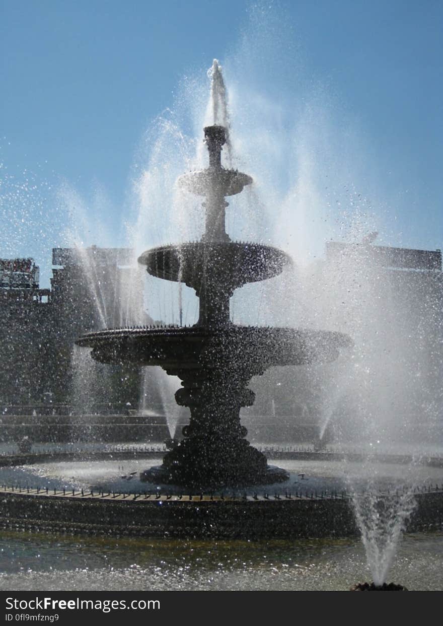 A three level fountain and splashy water around. A three level fountain and splashy water around.