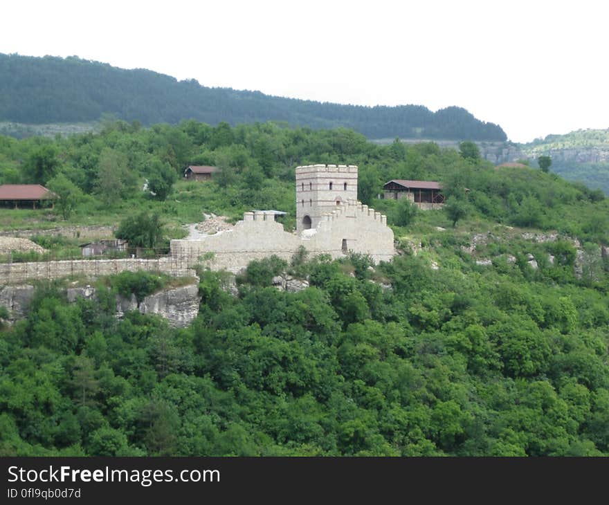 An old fortress on a green hill. An old fortress on a green hill.