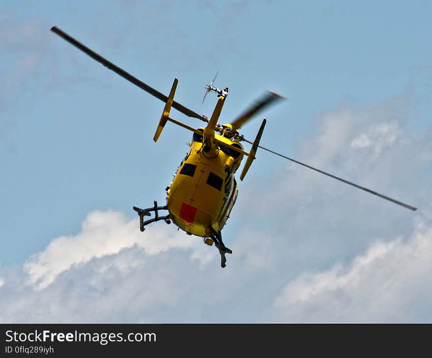 A helicopter flying on the blue sky. A helicopter flying on the blue sky.