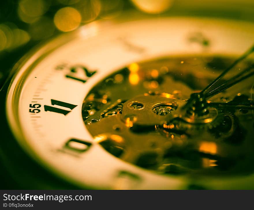 A close up of the face of a mechanical clock.