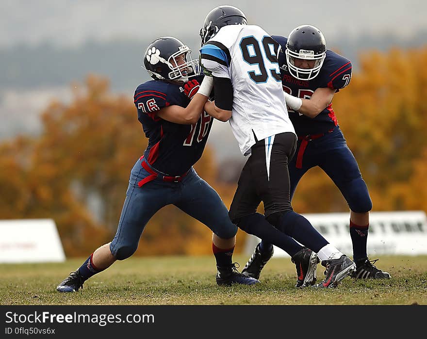 Athletes With Ball on the Background