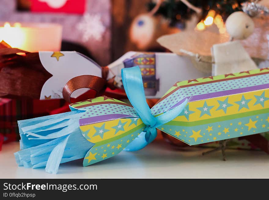 Close up of colorfully wrapped Christmas gifts.