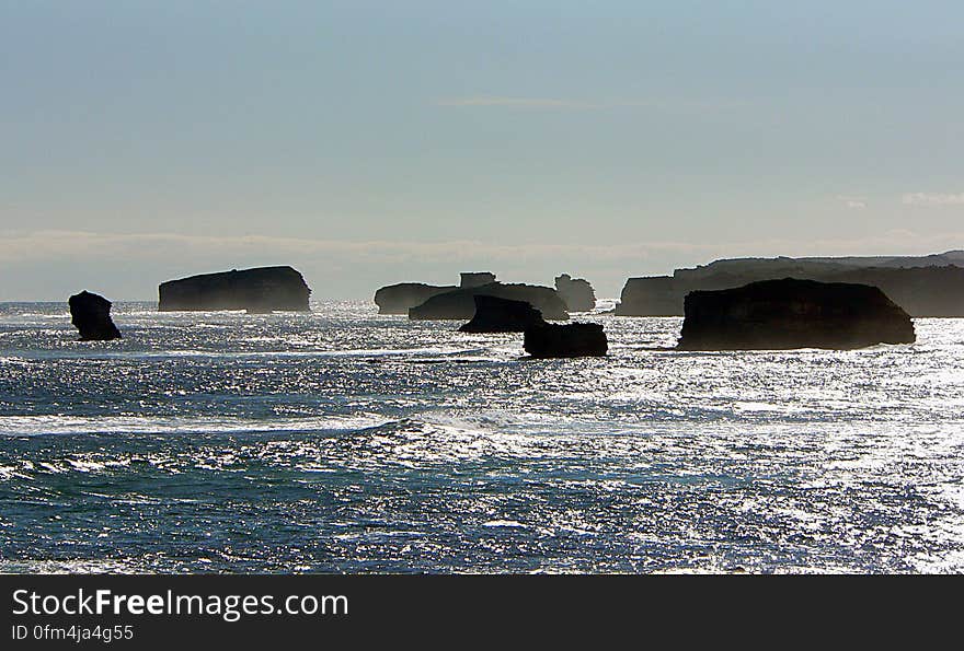 Bay of Martyrs At the outskirts of Peterborough, just off the Great Ocean Road, is this ideal place to see the stunning Bay of Martyrs. They are particularly beautiful at sunset when the islands and Massacre Point are backlit by the sun. The place names - Massacre Bay, Massacre Point, Bay of Martyrs - refer to a strong component of local oral history which suggests that Europeans killed a large group of Kirrae-Wurrong Aboriginal men by driving them off the cliffs hereabouts. The women and children were allegedly killed in a nearby swamp. Although there is, not surprisingly, no written evidence, it seems the local Aboriginal population dropped from a couple of thousand to virtually nil at some point, which may suggest migration but this is not what local folklore suggests. Bay of Martyrs At the outskirts of Peterborough, just off the Great Ocean Road, is this ideal place to see the stunning Bay of Martyrs. They are particularly beautiful at sunset when the islands and Massacre Point are backlit by the sun. The place names - Massacre Bay, Massacre Point, Bay of Martyrs - refer to a strong component of local oral history which suggests that Europeans killed a large group of Kirrae-Wurrong Aboriginal men by driving them off the cliffs hereabouts. The women and children were allegedly killed in a nearby swamp. Although there is, not surprisingly, no written evidence, it seems the local Aboriginal population dropped from a couple of thousand to virtually nil at some point, which may suggest migration but this is not what local folklore suggests.