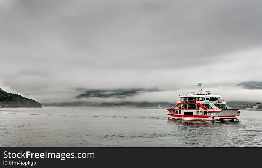 This is the ferry boat that brings visitors to Miyajima Island from Hiroshima, Japan. The rain was torrential on the day we visited but this photo was taken during a brief lull in the downpour. This is the ferry boat that brings visitors to Miyajima Island from Hiroshima, Japan. The rain was torrential on the day we visited but this photo was taken during a brief lull in the downpour.