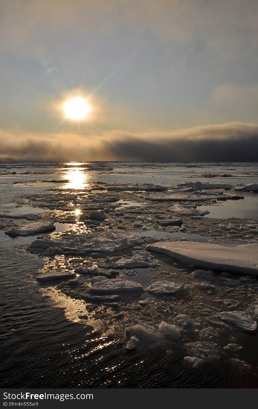 The sun hovers just above the Arctic Ocean horizon Sept. 9, 2009. Photo Credit: Patrick Kelley, U.S. Coast Guard. The sun hovers just above the Arctic Ocean horizon Sept. 9, 2009. Photo Credit: Patrick Kelley, U.S. Coast Guard