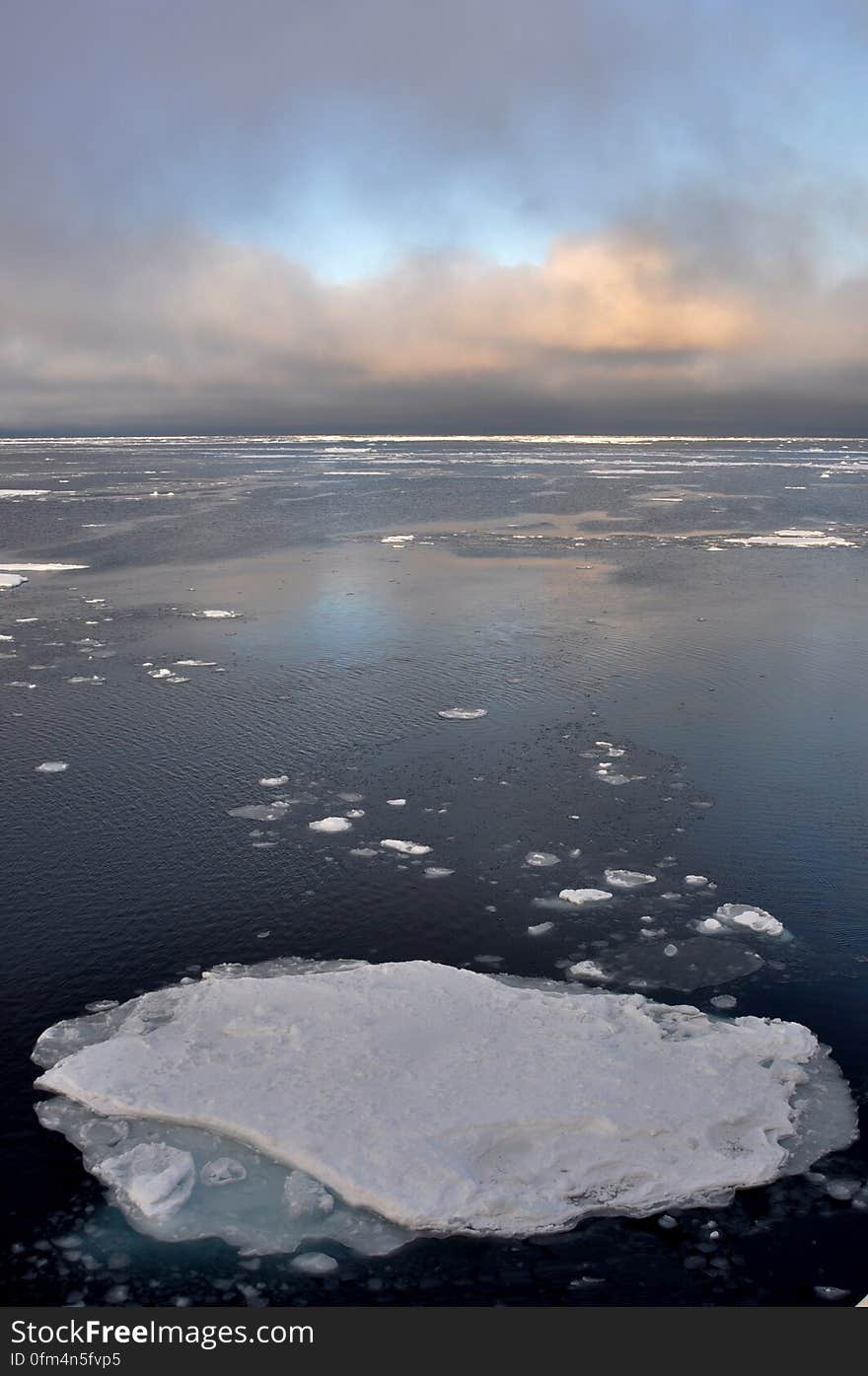 The clouds begin to thin over the Arctic Ocean Sept. 9, 2009. Photo Credit: Patrick Kelley, U.S. Coast Guard. The clouds begin to thin over the Arctic Ocean Sept. 9, 2009. Photo Credit: Patrick Kelley, U.S. Coast Guard