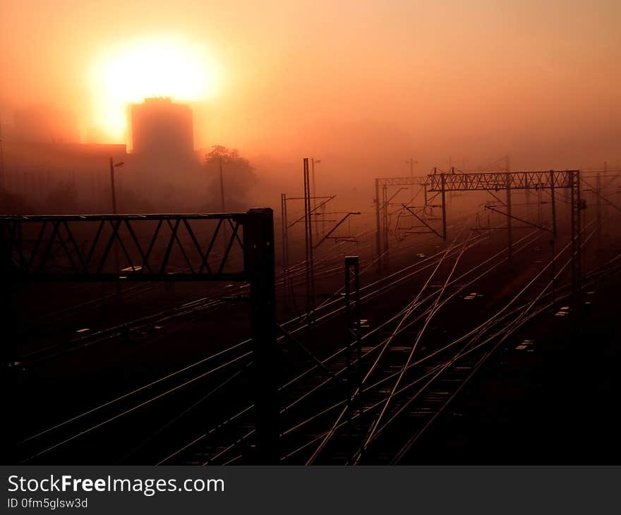 Cars Traveling on Gray Asphalt Road during Sunset