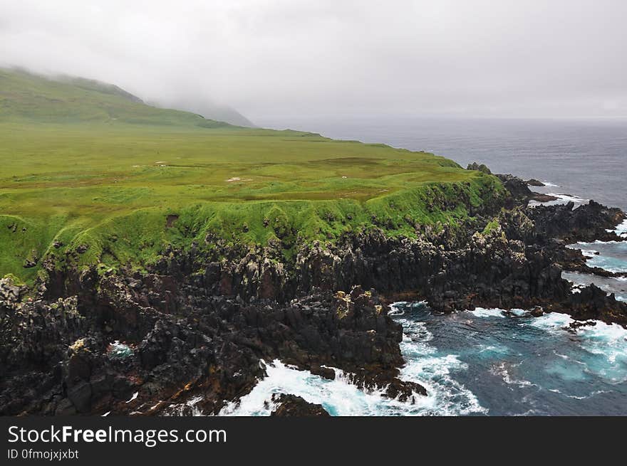 Carlisle Island — A view of the west coastal lava delta on Carlisle Island volcano in Alaska. This photo was taken during the 2014 field season of the Islands of Four Mountains multidisciplinary project, work funded by the National Science Foundation, the USGS/AVO, and the Keck Geology Consortium. Learn more about Carlisle volcano, recent activity, and more at: on.doi.gov/Carlisle. Photo credit: Christina Neal, USGS, 2014. Carlisle Island — A view of the west coastal lava delta on Carlisle Island volcano in Alaska. This photo was taken during the 2014 field season of the Islands of Four Mountains multidisciplinary project, work funded by the National Science Foundation, the USGS/AVO, and the Keck Geology Consortium. Learn more about Carlisle volcano, recent activity, and more at: on.doi.gov/Carlisle. Photo credit: Christina Neal, USGS, 2014.