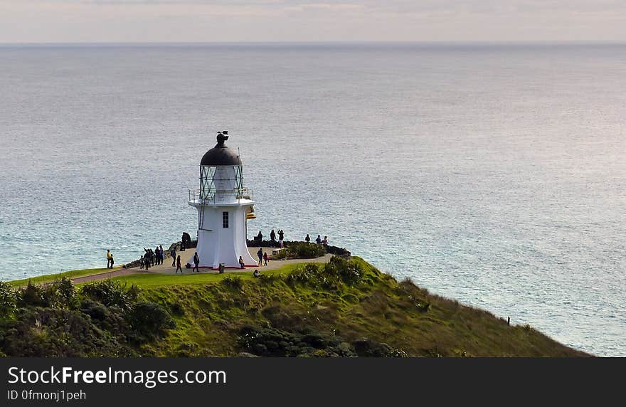 Cape Reinga, official name Cape Reinga/Te Rerenga Wairua, is the northwesternmost tip of the Aupouri Peninsula, at the northern end of the North Island of New Zealand. Cape Reinga is more than 100 km north of the nearest small town of Kaitaia. Cape Reinga, official name Cape Reinga/Te Rerenga Wairua, is the northwesternmost tip of the Aupouri Peninsula, at the northern end of the North Island of New Zealand. Cape Reinga is more than 100 km north of the nearest small town of Kaitaia.