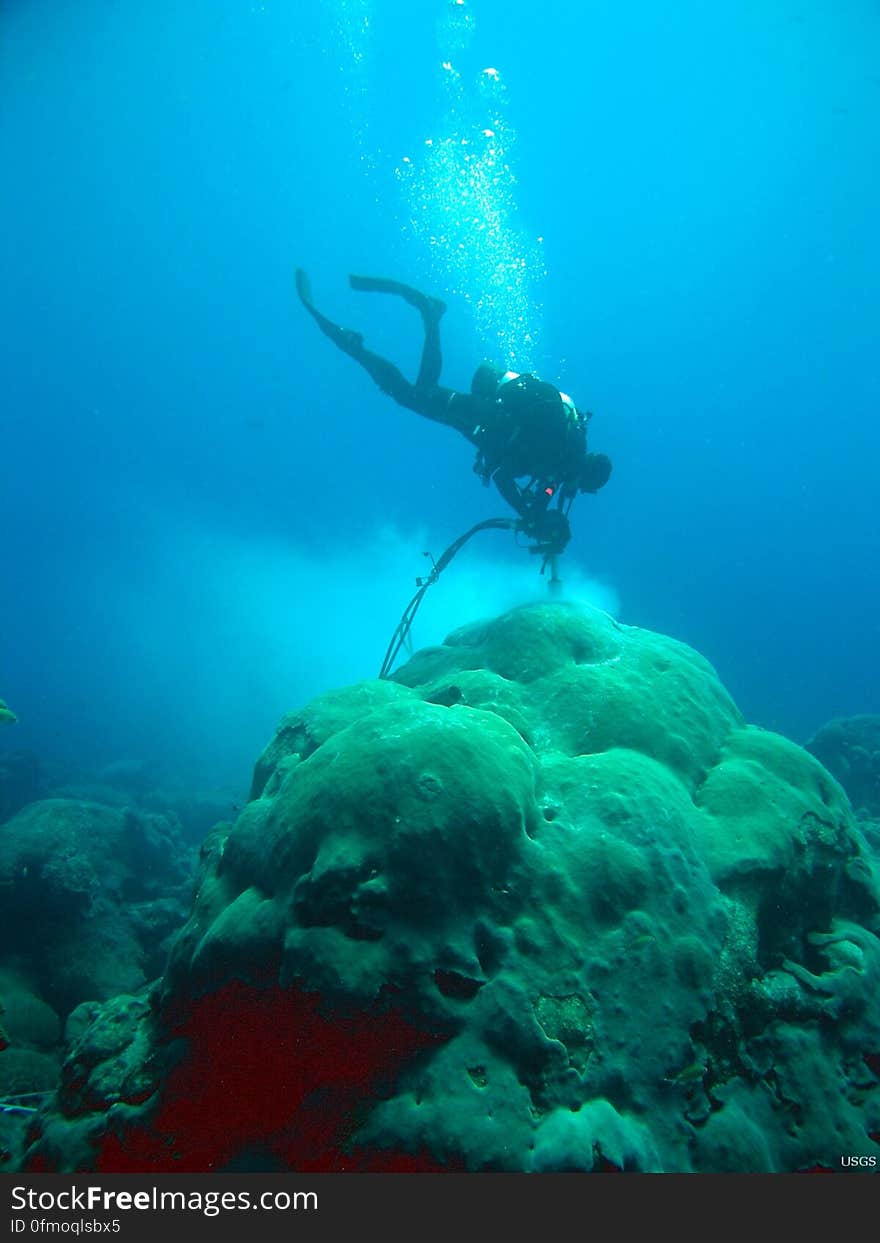 Not all USGS science happens on the land...we also like to go for a swim every now and then! Here we see one of scientists, Christopher Reich, as he core drills coral to collect cores for paleoclimate analyses off the coast of Florida. Credit: Don Hickey, USGS. Not all USGS science happens on the land...we also like to go for a swim every now and then! Here we see one of scientists, Christopher Reich, as he core drills coral to collect cores for paleoclimate analyses off the coast of Florida. Credit: Don Hickey, USGS.