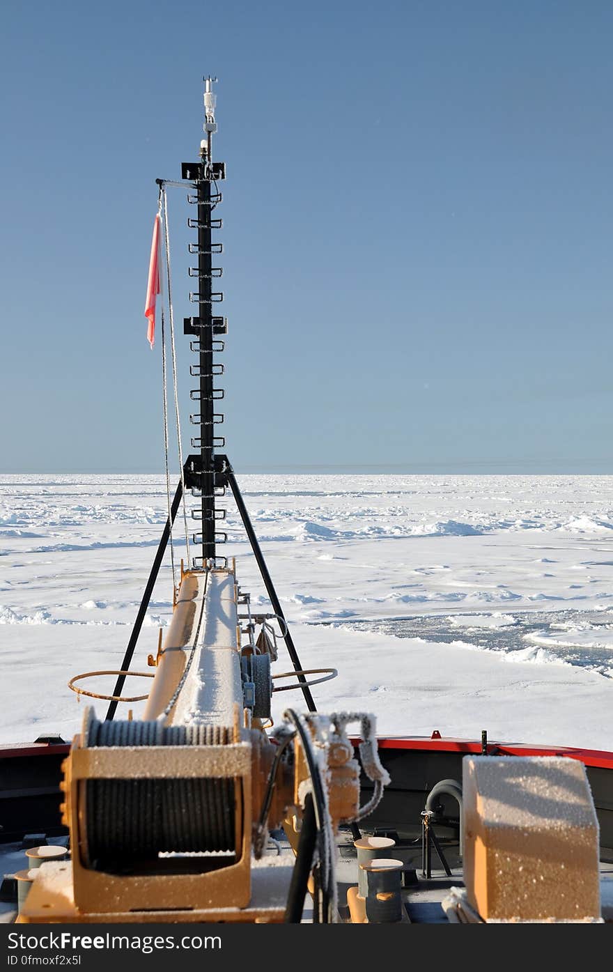 A frozen flag on the bow of the Coast Guard Cutter Healy fails to flap as the ship breaks ice on the Arctic Ocean Sept. 1, 2009. Photo Credit: Patrick Kelley, U.S. Coast Guard