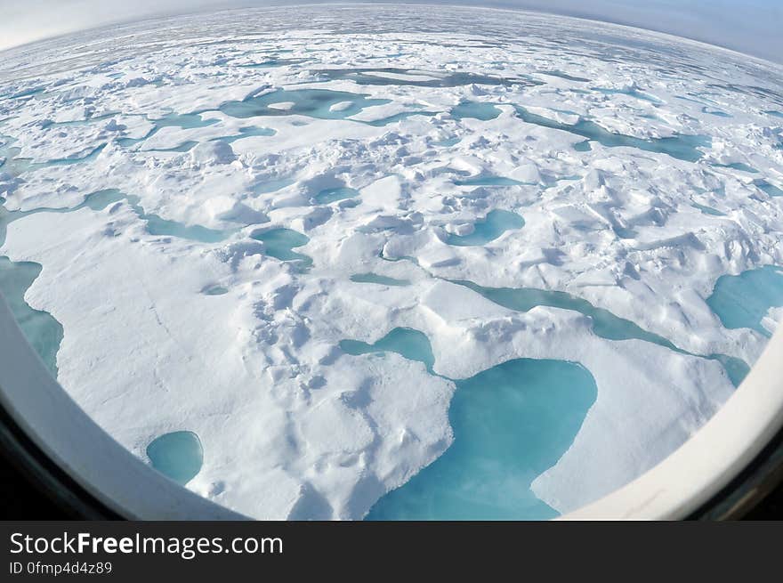 ARCTIC OCEAN - A multi-year ice floe slides down the starboard side of the Coast Guard Cutter Healy Aug. 12, 2009, as the ship heads north into even thicker ice. &#x22;You can tell that this is a multi-year ice floe by the light blue melt ponds that have formed on top of the floe,&#x22; said Pablo Clemente-Colón, chief scientist at the U.S. National Ice Center. Photo Credit: Patrick Kelley, U.S. Coast Guard. ARCTIC OCEAN - A multi-year ice floe slides down the starboard side of the Coast Guard Cutter Healy Aug. 12, 2009, as the ship heads north into even thicker ice. &#x22;You can tell that this is a multi-year ice floe by the light blue melt ponds that have formed on top of the floe,&#x22; said Pablo Clemente-Colón, chief scientist at the U.S. National Ice Center. Photo Credit: Patrick Kelley, U.S. Coast Guard