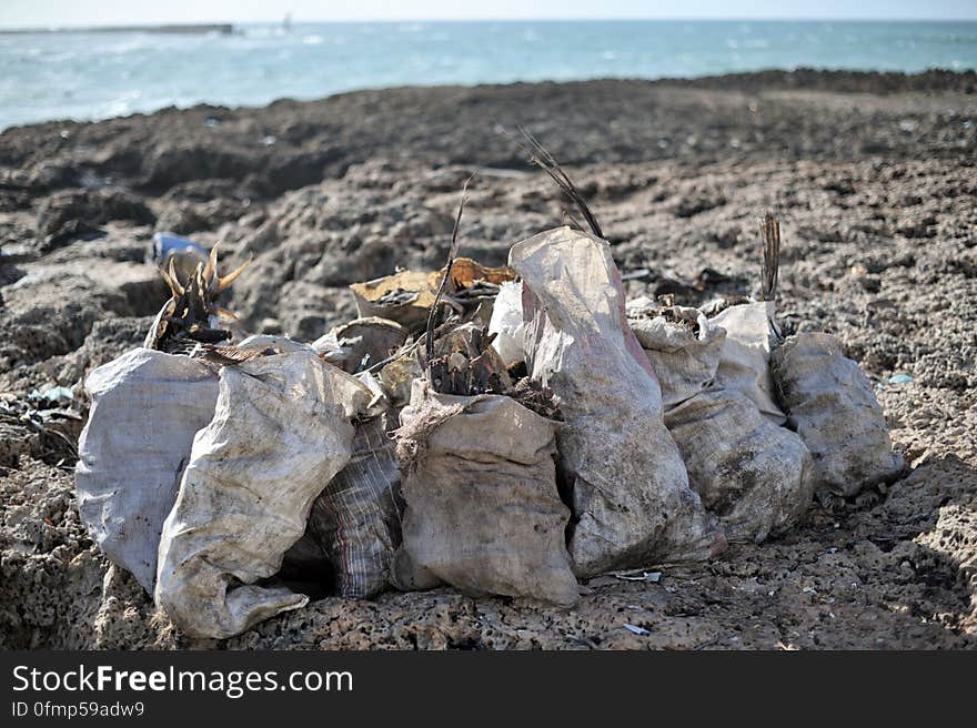 Sacks of dried fish sit on the rocks drying in front of Mogadishu&#x27;s fish market in Somalia on May 22. AU UN IST PHOTO / TOBIN JONES. Sacks of dried fish sit on the rocks drying in front of Mogadishu&#x27;s fish market in Somalia on May 22. AU UN IST PHOTO / TOBIN JONES.