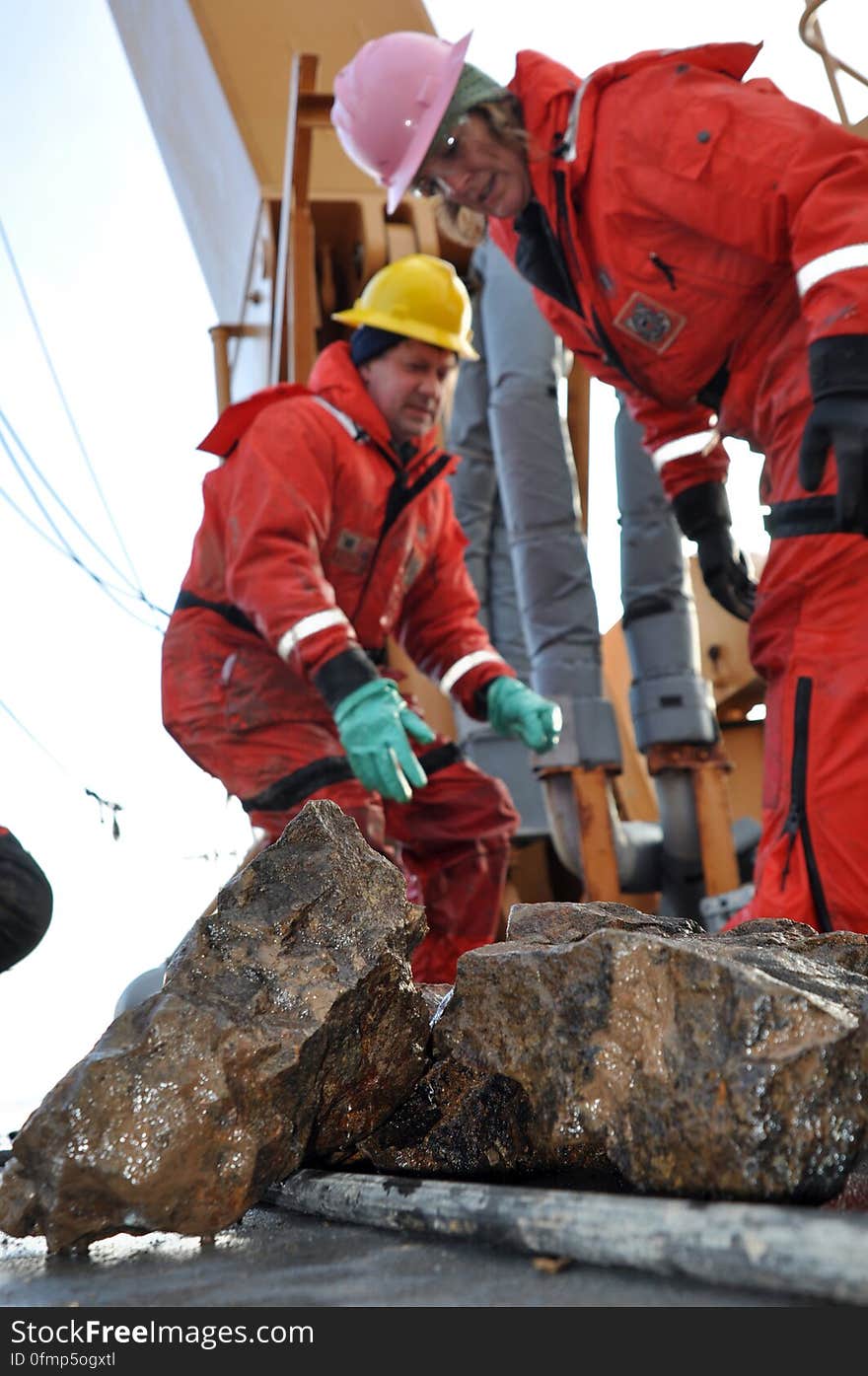 ARCTIC OCEAN - Dr. Alex Andronikov, a geologist from the University of Michigan Department of Geological Science, and Kelley Brumley, a geologist from Stanford University, sort through rocks that were dredged from the Arctic Ocean floor Sept. 9, 2009, aboard the Coast Guard Cutter Healy.The dredging is part of the U.S. Extended Continental Shelf Task Force&#x27;s effort to locate the outer reaches of the North American continental shelf.&#x28;U.S. Coast Guard photo by Petty Officer Patrick Kelley&#x29; Photo Credit: Patrick Kelley, U.S. Coast Guard. ARCTIC OCEAN - Dr. Alex Andronikov, a geologist from the University of Michigan Department of Geological Science, and Kelley Brumley, a geologist from Stanford University, sort through rocks that were dredged from the Arctic Ocean floor Sept. 9, 2009, aboard the Coast Guard Cutter Healy.The dredging is part of the U.S. Extended Continental Shelf Task Force&#x27;s effort to locate the outer reaches of the North American continental shelf.&#x28;U.S. Coast Guard photo by Petty Officer Patrick Kelley&#x29; Photo Credit: Patrick Kelley, U.S. Coast Guard