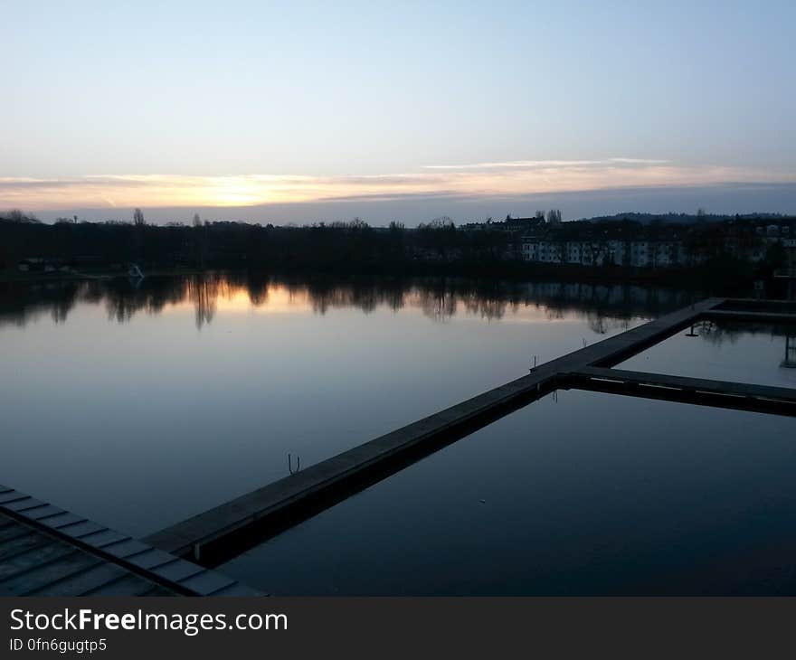 Empty bridge over water in countryside at sunset. Empty bridge over water in countryside at sunset.