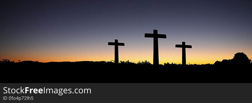 Landscape View of 3 Cross Standing during Sunset